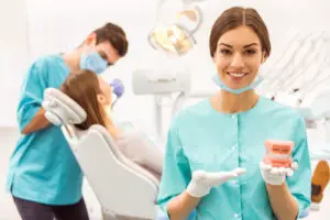 dentist and dental hygienist with patient
