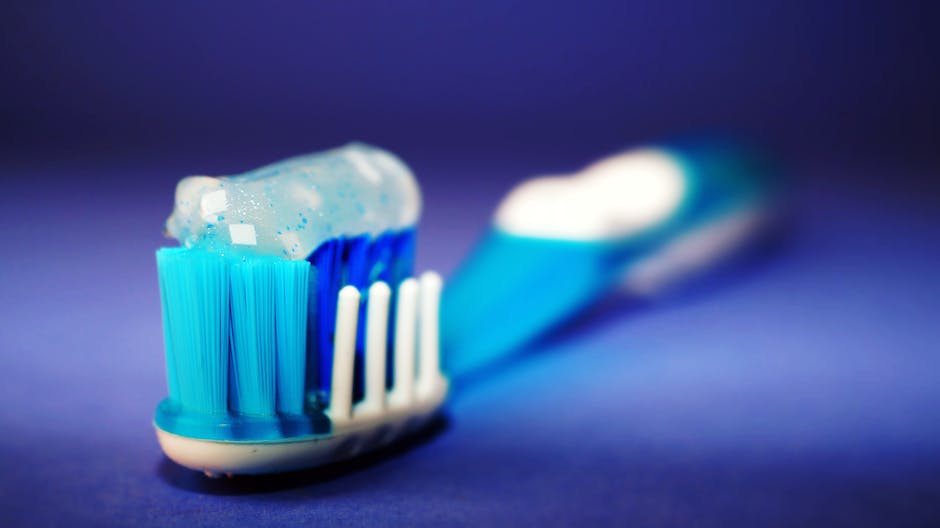 Image depicting oral health, highlighting teeth and a toothbrush.